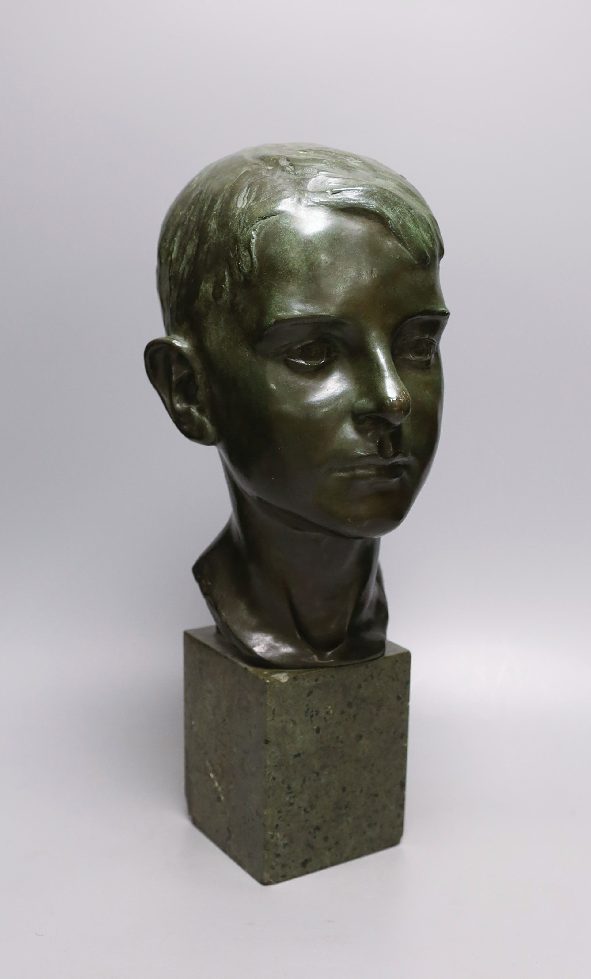 Ida Nelson, a green patinated bronze head of a boy, signed and dated 1926, 42 cms high.